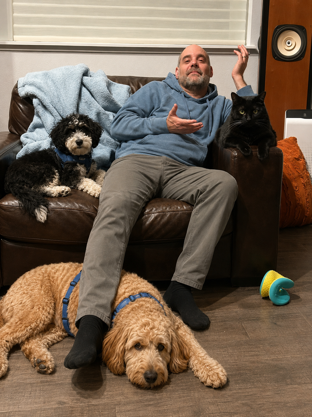 Jay Strear at home on the couch with his pets